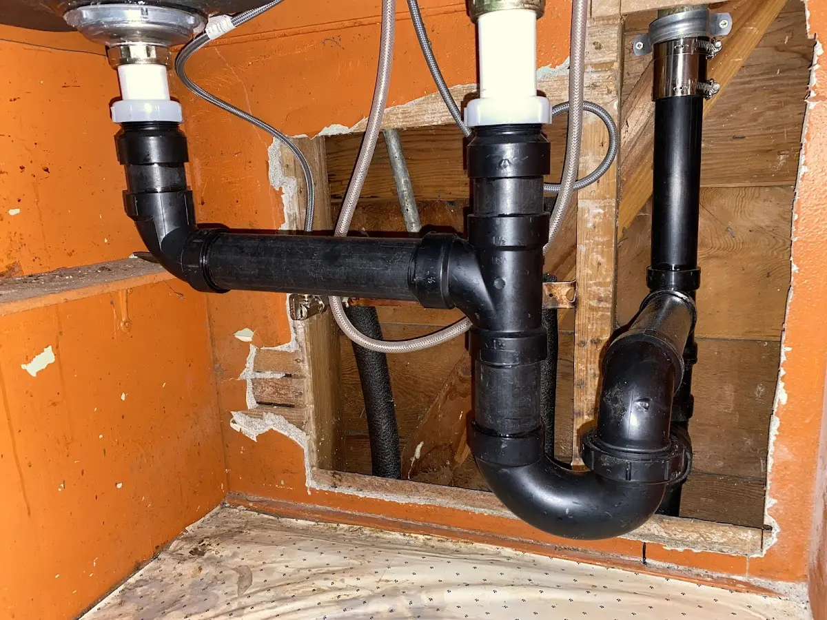 Professional Garbage Disposal Repair equipment and tools on the job in Barrington